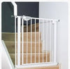White metal gate on a wooden staircase 
