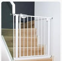White metal gate on a wooden staircase 